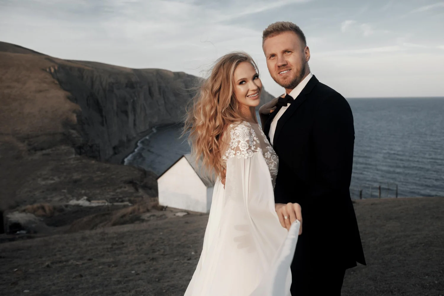 Elegant wedding photo on cliff edge