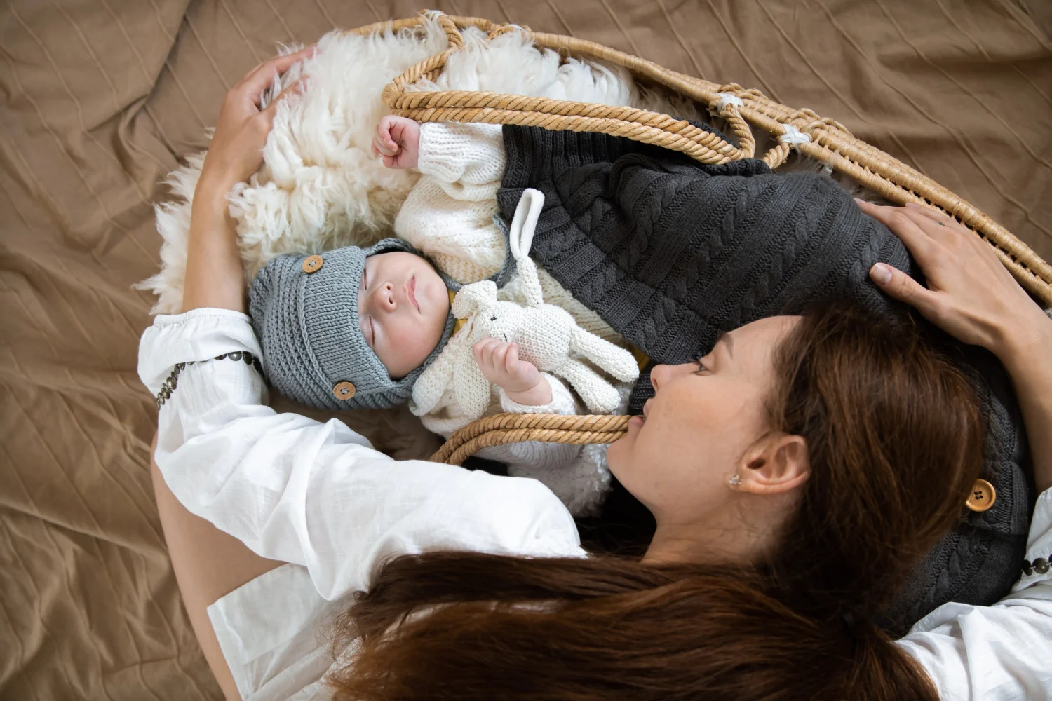 Cute newborn baby in cradle