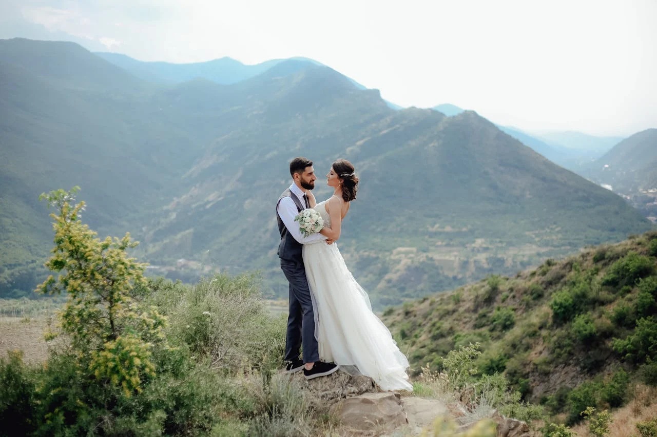 Couple elopement photos with mountain backdrop