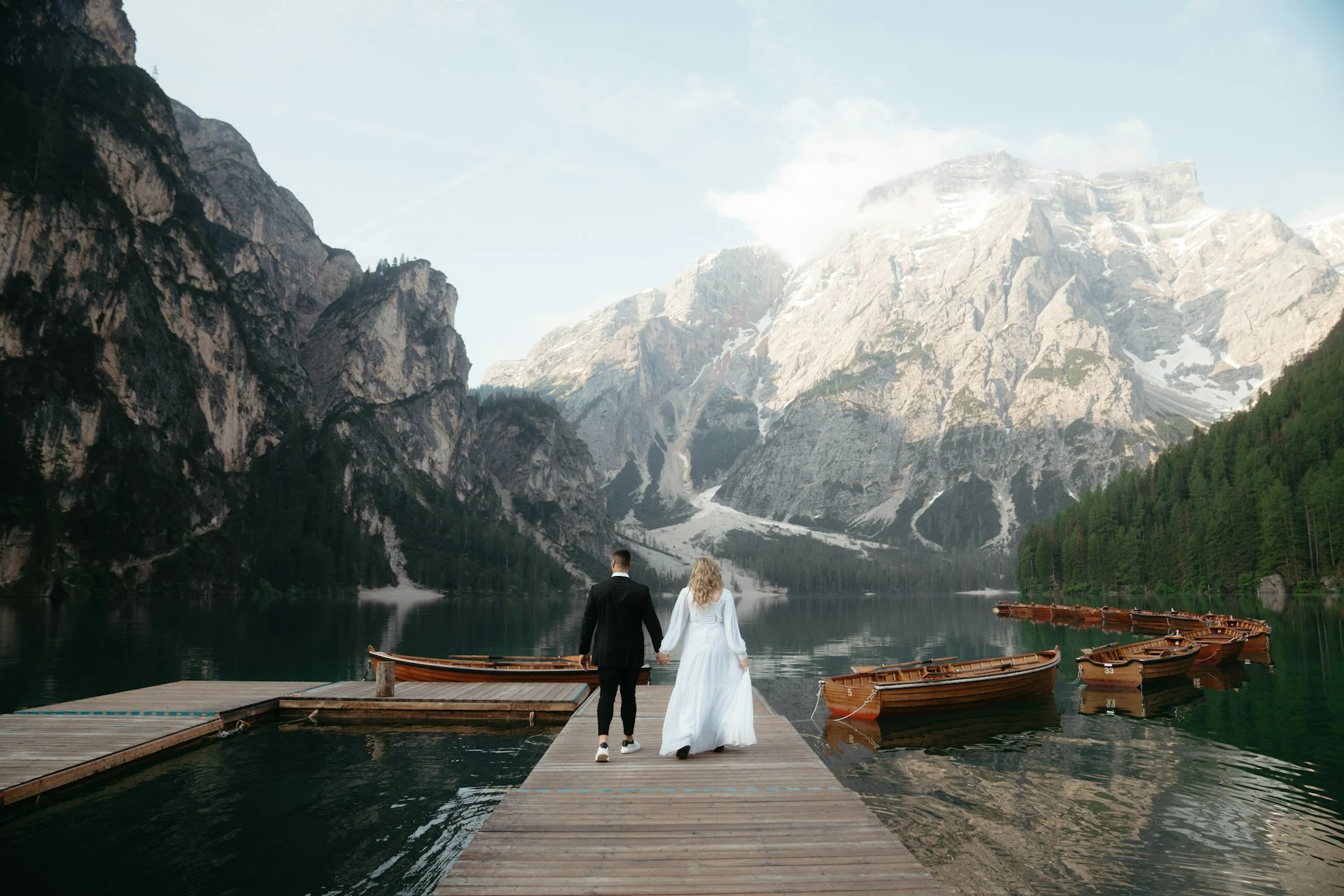 Elopement photo with mountain and lake backdrop