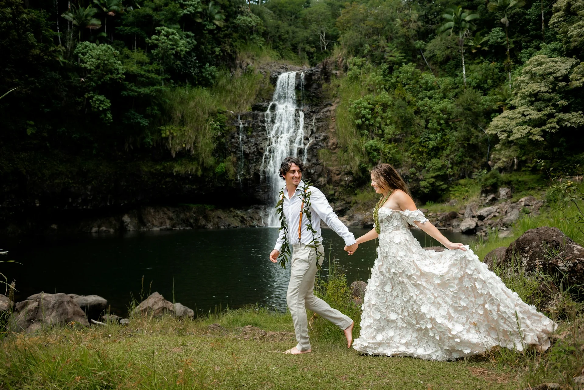 Bride and groom holding hands during their Hawaii elopement