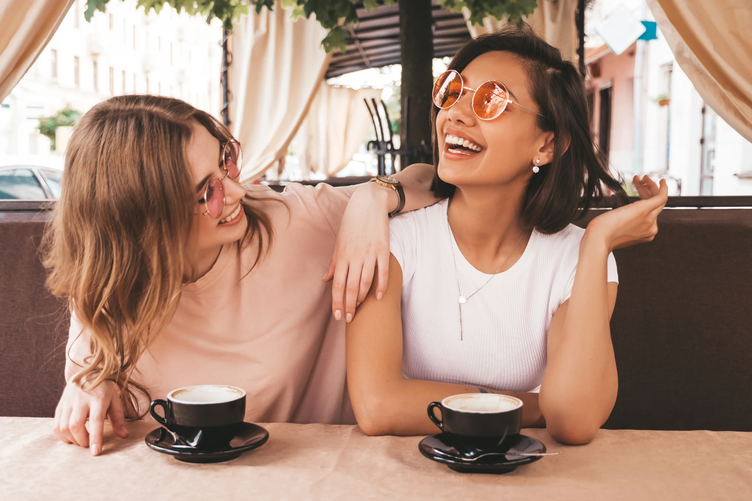 Two young women enjoying coffee